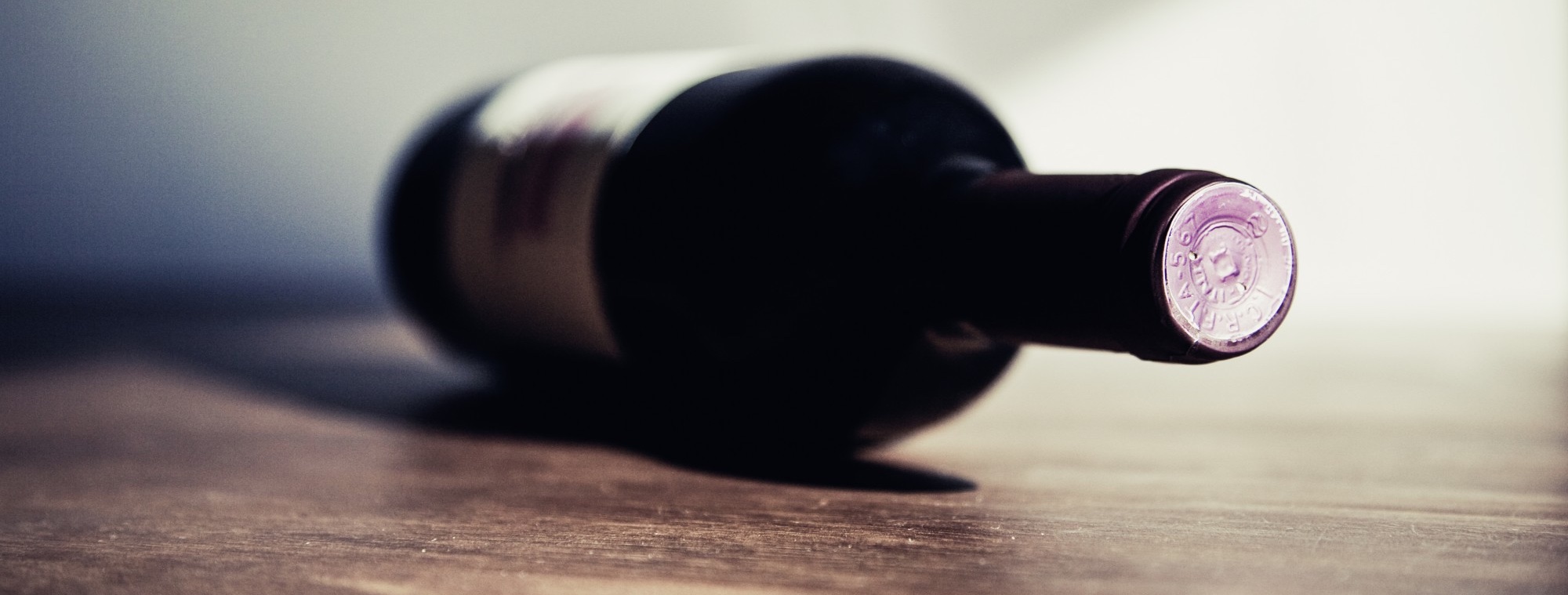 A bottle of red wine on a table